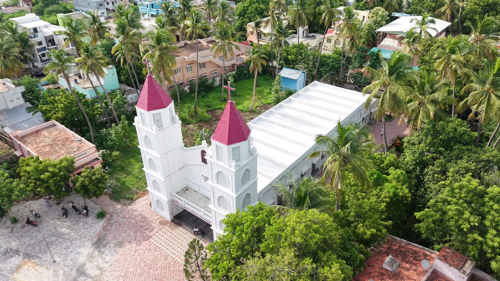 A wide view of the church set against the town of Lalgudi