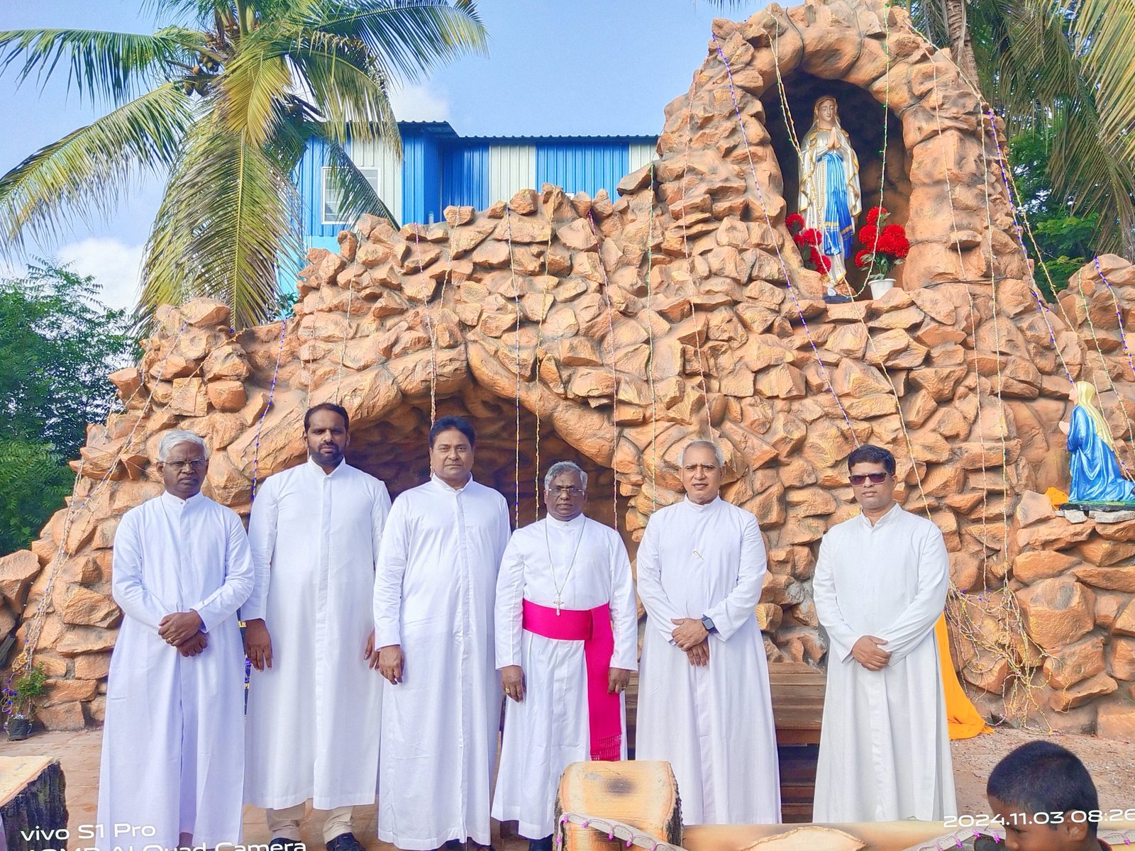 The Bishop and clergy at the Marian grotto
