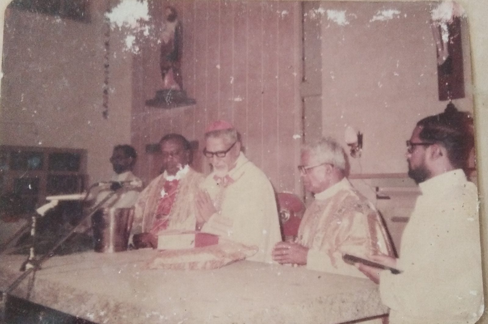 An archival photograph of a Holy Mass concelebrated with the Bishop